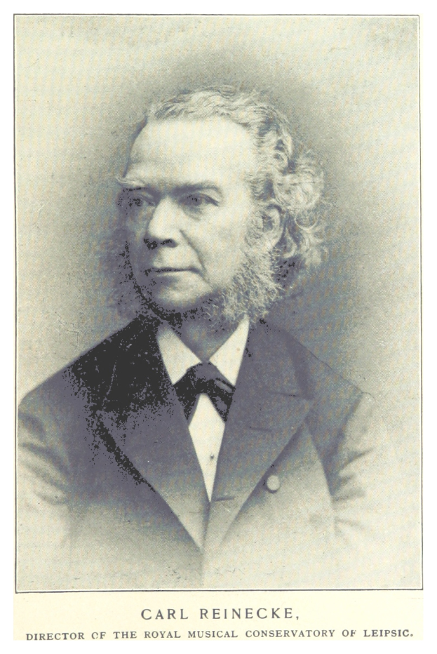 Ein Schwarz-Weiß-Foto von Carl Reinecke, dem Direktor des Königlichen Musik-Konservatoriums Leipzig, der einen Anzug trägt, mit Text am unteren Bildrand.