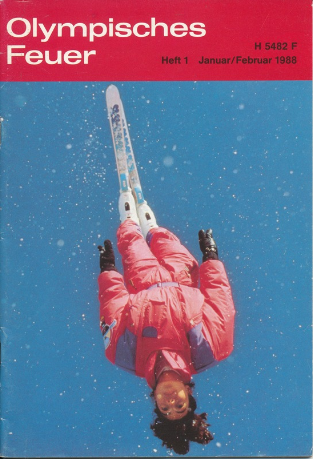Ein Buchumschlag mit einem Skifahrer in der Luft, der einen Skianzug trägt, mit der Aufschrift "Olympic Games Feuer - Heft 1 - Januar/Februar 1988".