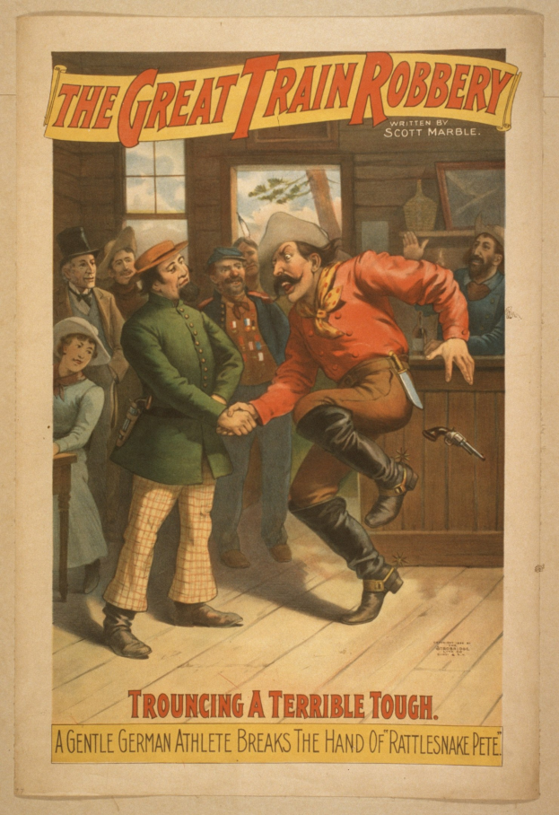 Plakat zeigt eine Gruppe von Menschen auf einem Boden mit einer Person, die eine Waffe hält, ein Fenster und eine Wand im Hintergrund und den Text "Die große Zugüberfall - Trouching ein Schreckliches Unglück" oben und unten.