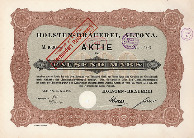 Ein altes Aktienzertifikat mit einem roten Stempel, das gedruckten Text enthält, der die Aktiennennwert angibt.