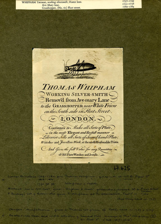 Altes Buch mit einer Grashüpfer-Illustration auf dem Cover und lesbarer Text auf den Seiten.